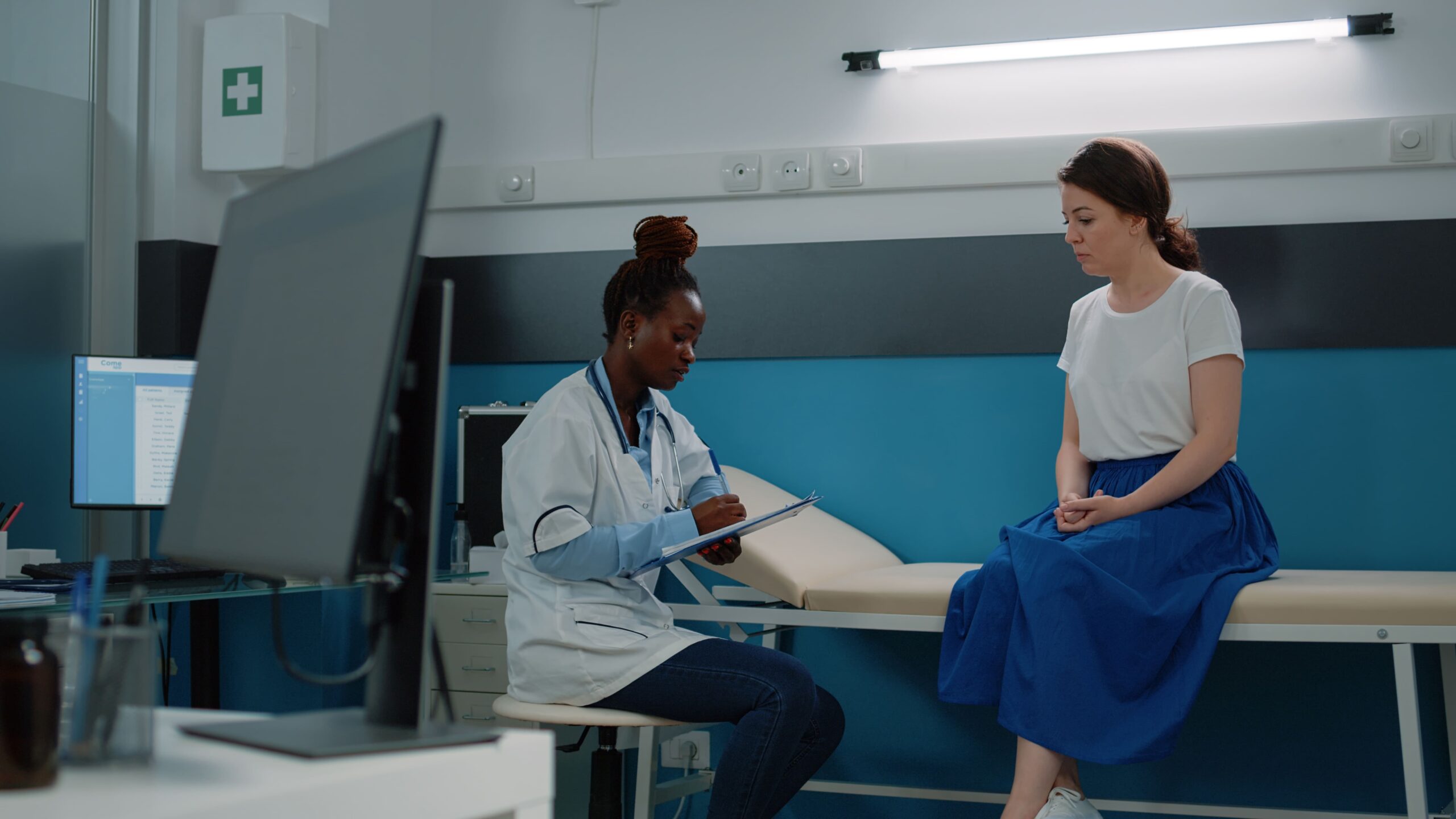 A female patient undergoing a radiology scan at a mammogram clinic